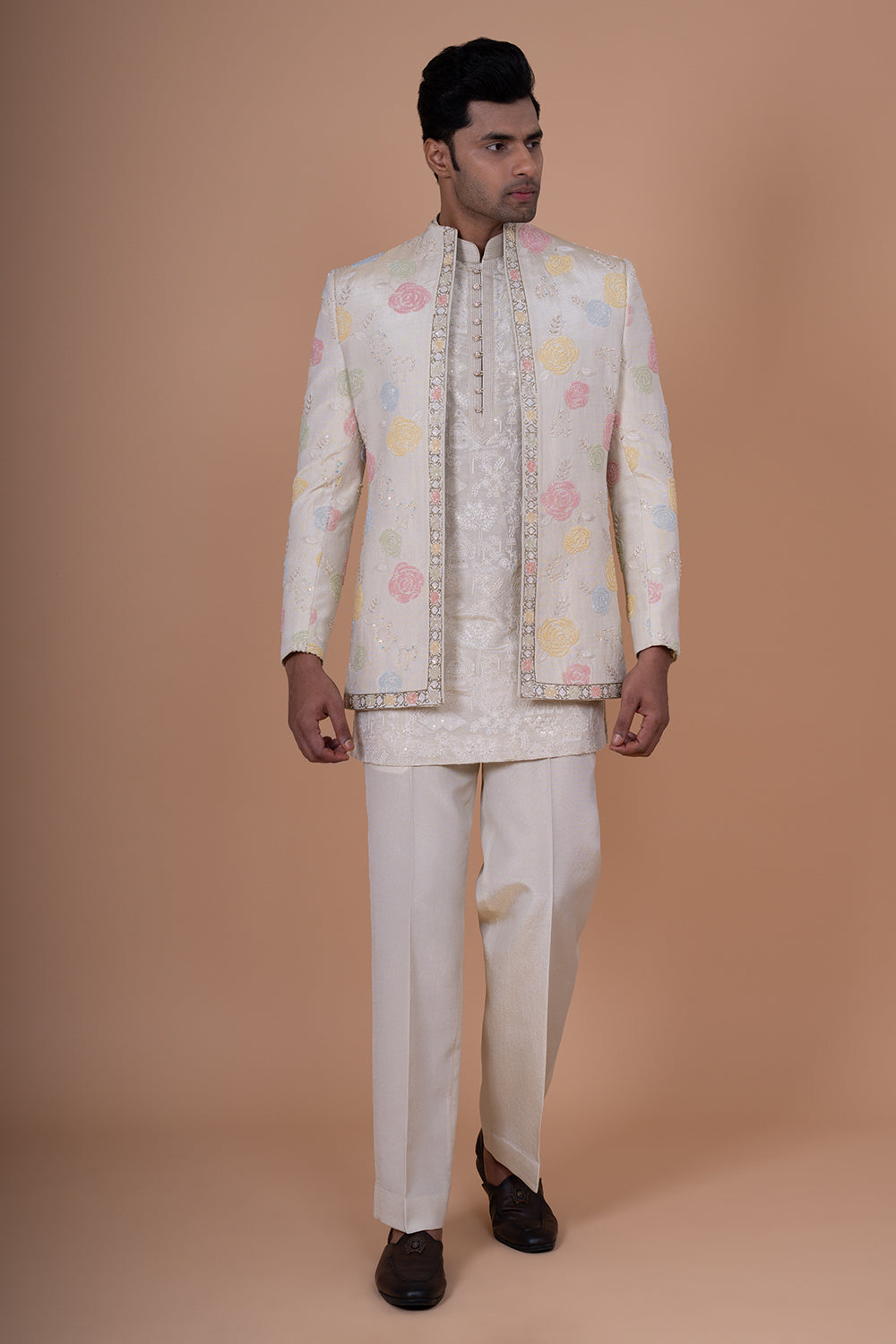 Ivory Raw Silk Bundi Jacket with Pastel Floral Thread Work and Mirror Accents.