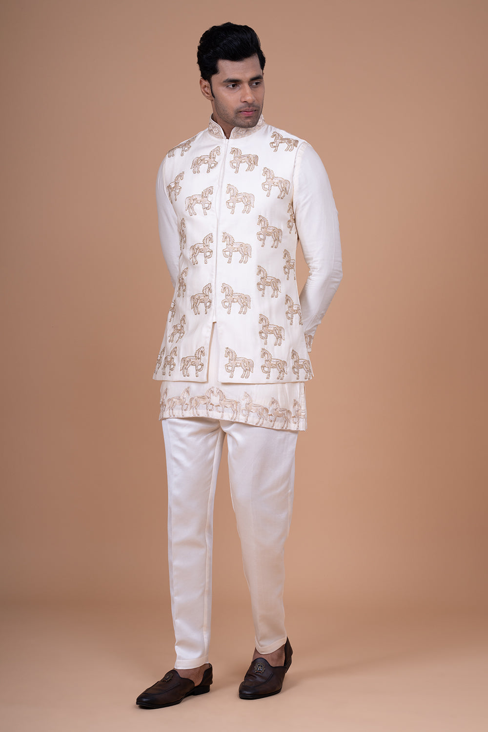 Ivory Raw Silk Sleeveless Bundi Jacket with Gold Zari Horse Embroidery.