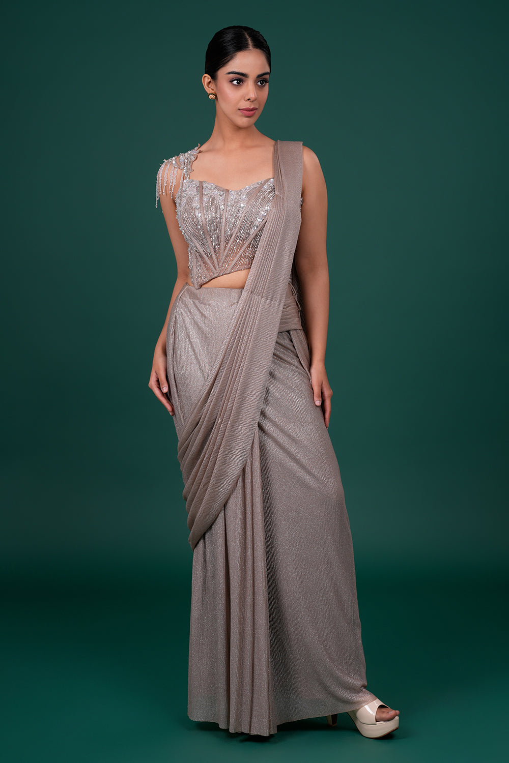 Metallic Pre-Draped Shimmer Saree with Asymmetrical Embellished Corset Blouse.
