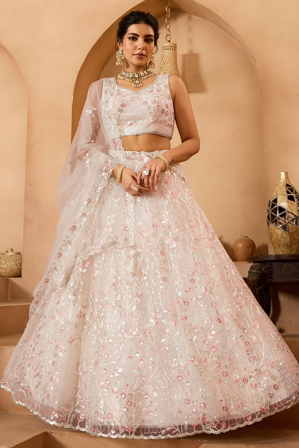 NET LEHENGA CHOLI WITH SEQUINS AND RESHAM EMBROIDERY