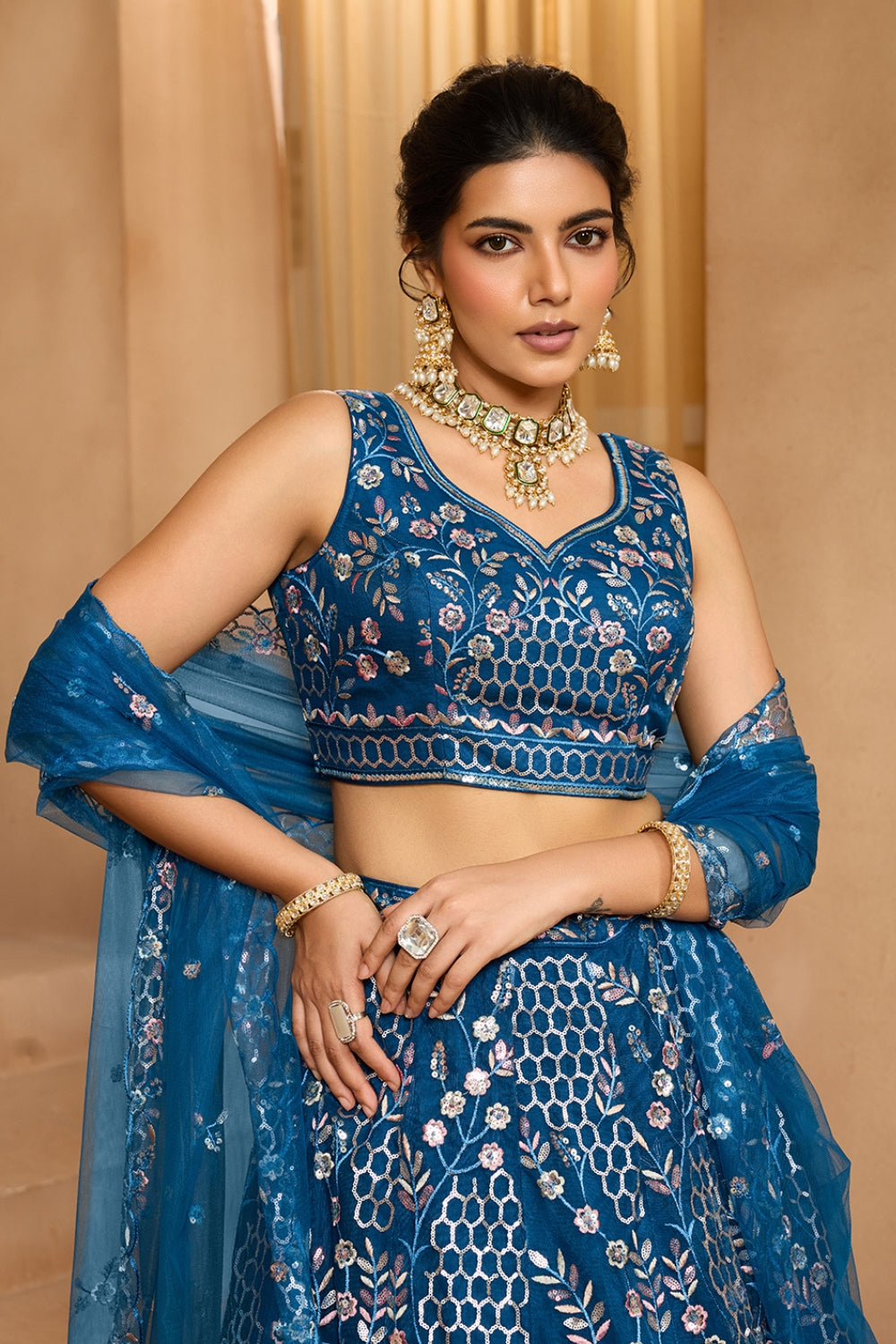 NET LEHENGA CHOLI WITH SEQUINS AND RESHAM EMBROIDERY