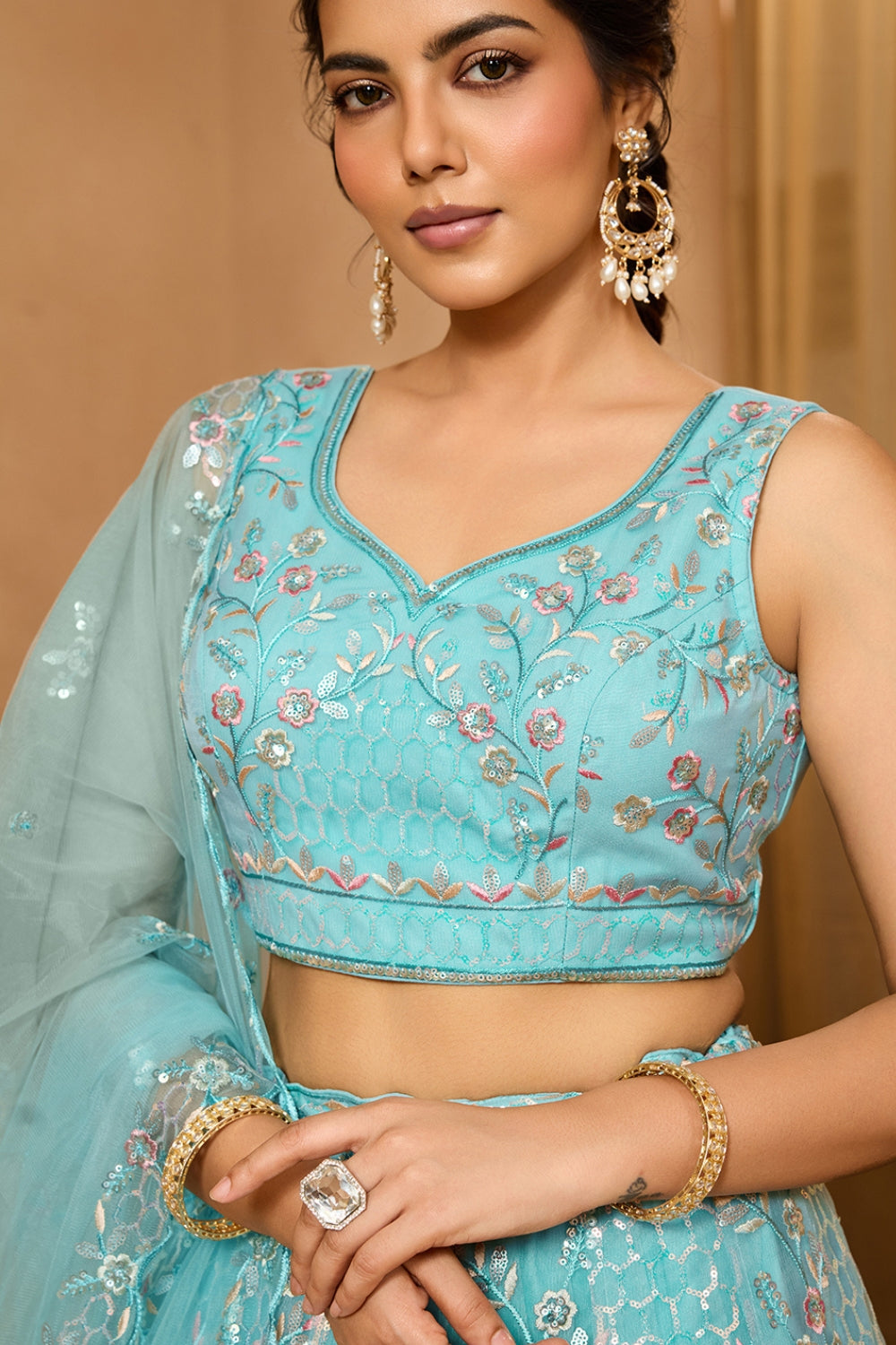 NET LEHENGA CHOLI WITH SEQUINS AND RESHAM EMBROIDERY