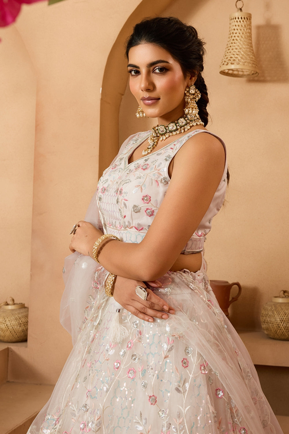 NET LEHENGA CHOLI WITH SEQUINS AND RESHAM EMBROIDERY