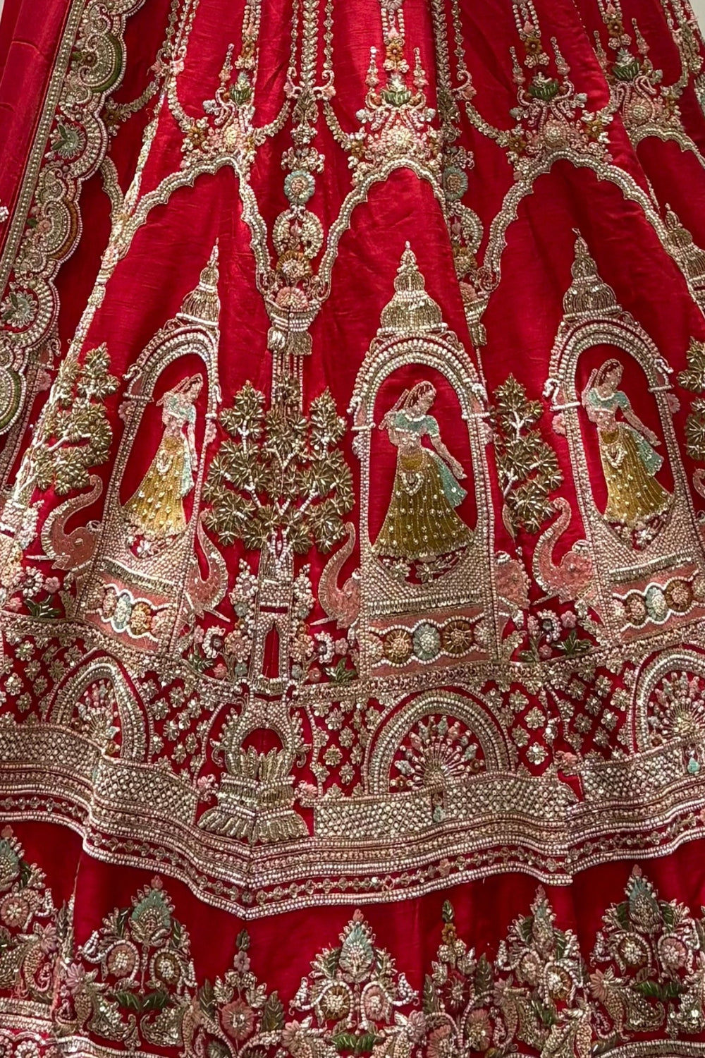 RED SILK BRIDAL LEHENGA SET WITH CUTDANA AND MOTI WORK